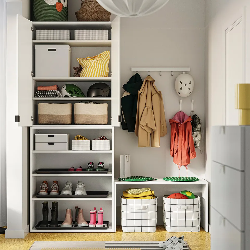 Organised closet with shelves, bins, adjustable feet.