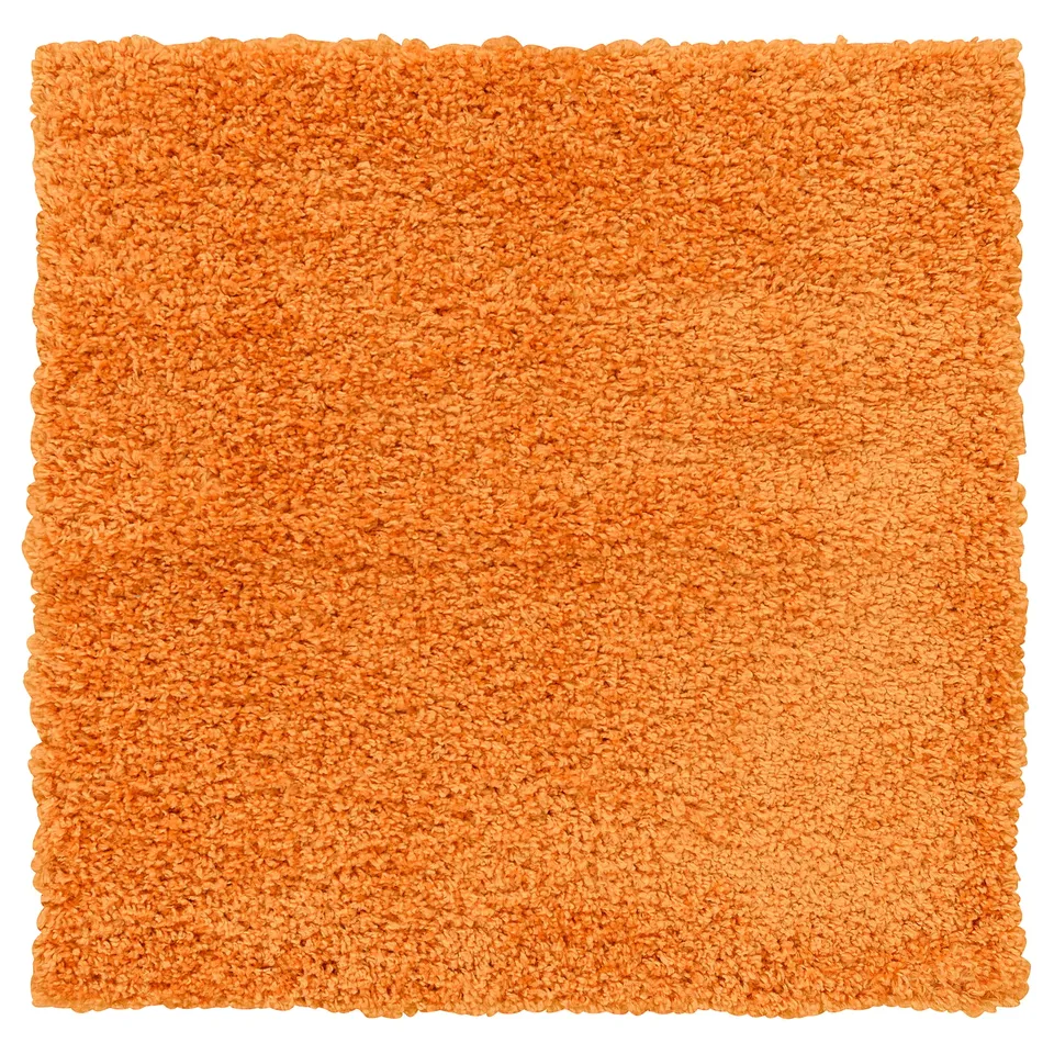 Orange, square, shaggy area rug. Soft, dense fibres for comfort.