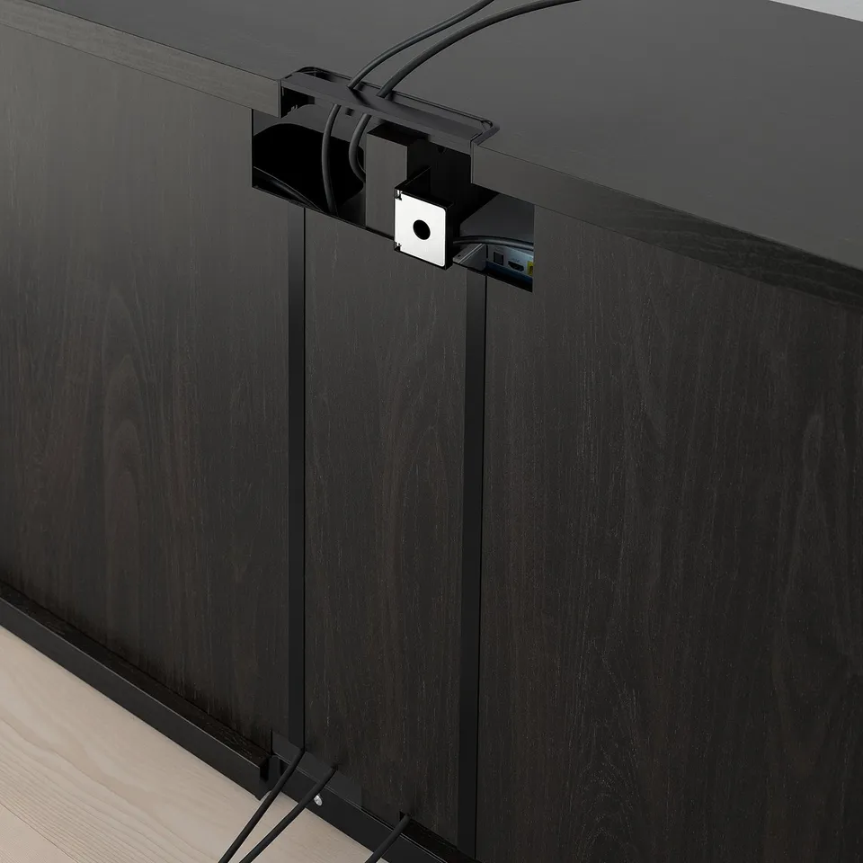 Black tv stand with cable management.