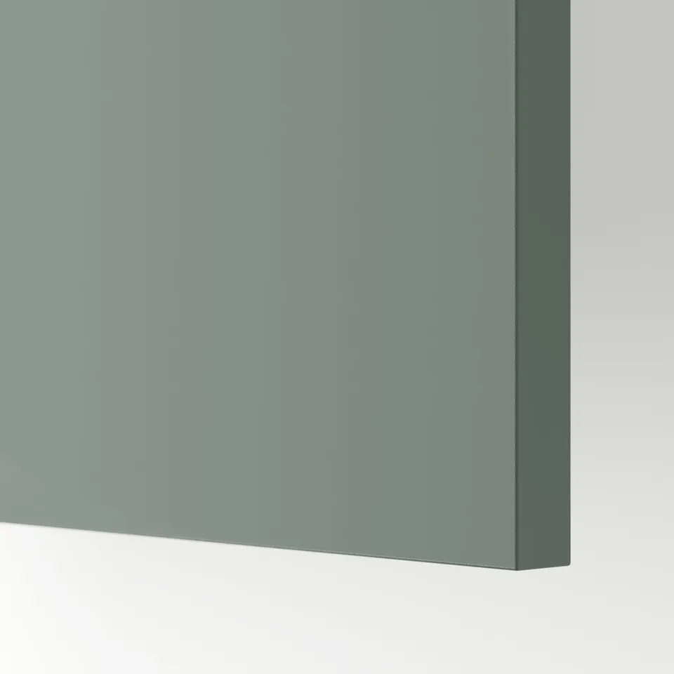 Close-up of modern grey-green kitchen cabinet, smooth surface, high-quality finish.