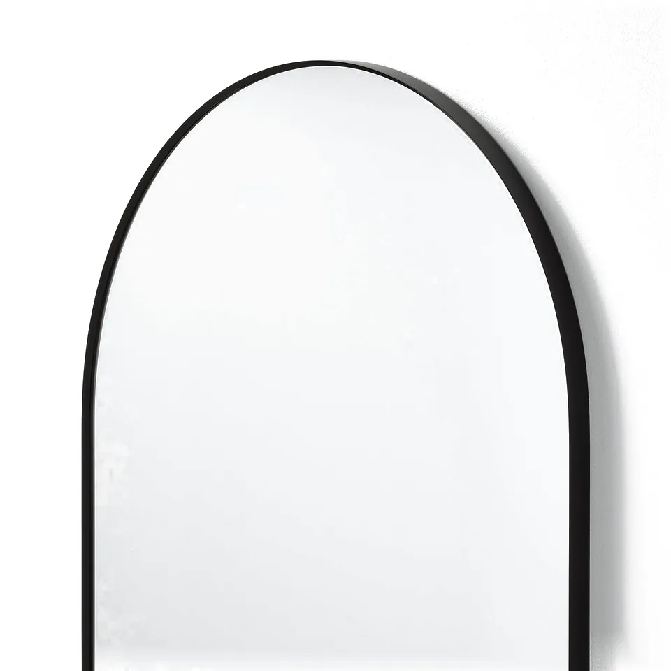 Elegant arched mirror with slim black frame, reflecting clear image, securely placed.