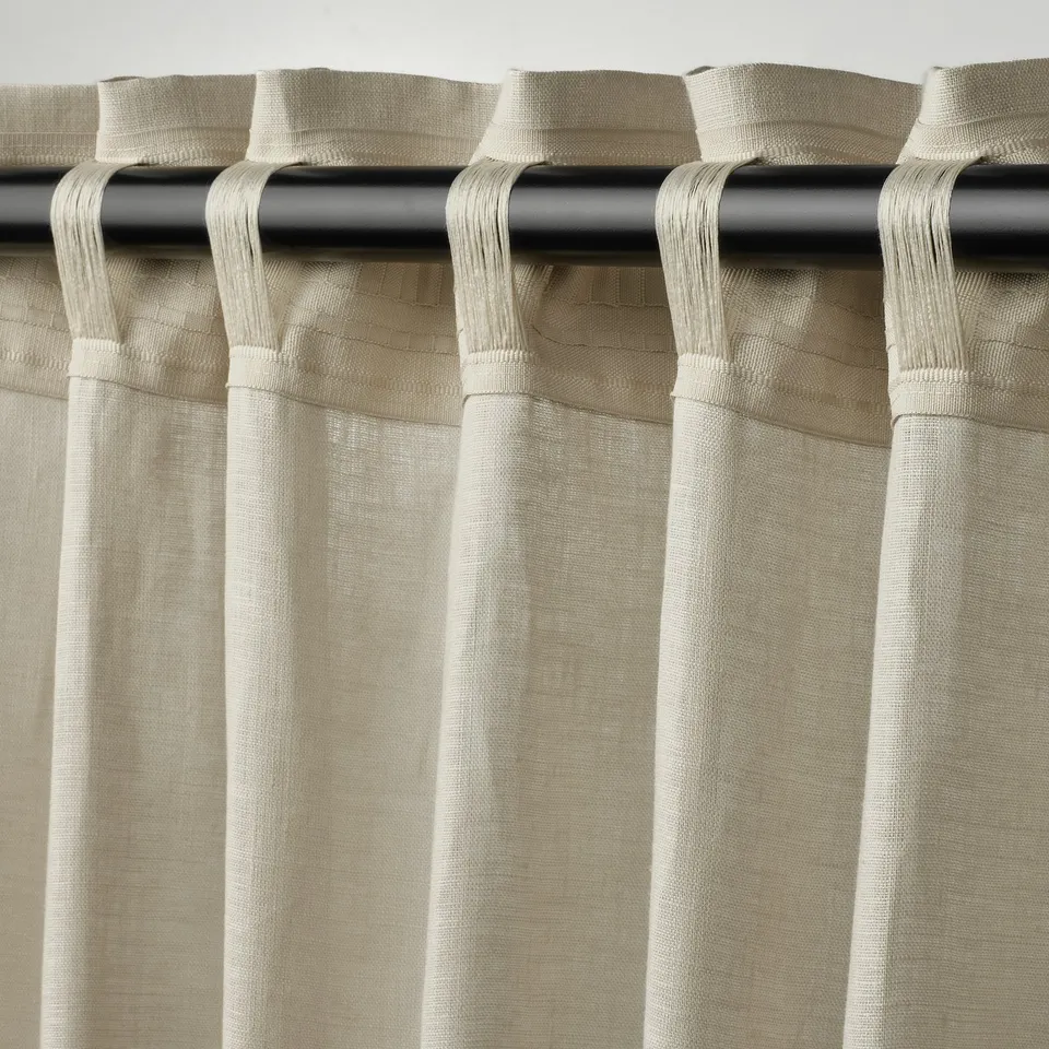 Curtains with multi-header tape hang neatly. Tape allows for rod or rail use and creates uniform pleats.