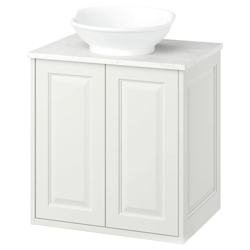A white TÄNNFORSEN vanity with a marble countertop and a round bowl sink. It offers classic elegance with bevelled edges.