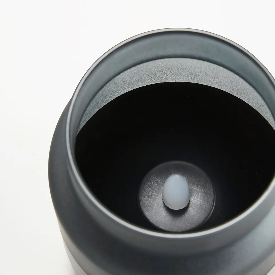 Close-up of an elegant led candle with frosted glass, showcasing a flickering flame effect.