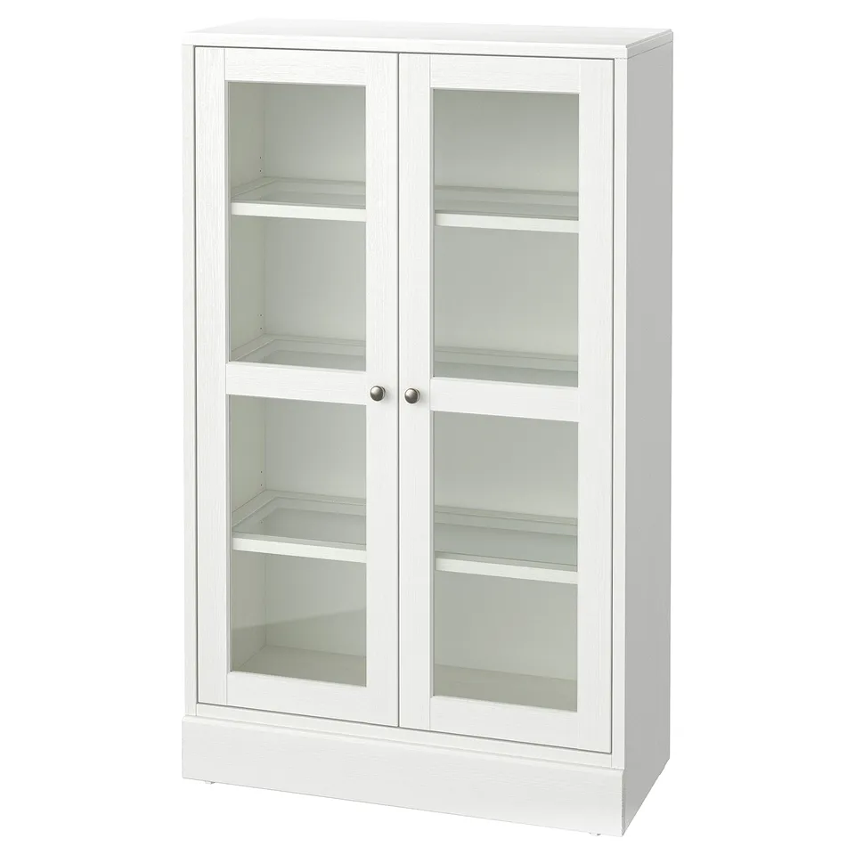 White HAVSTA wooden cabinet with glass doors, rustic design, soft-close mechanism, pine and glass, rectangular, and three shelves.