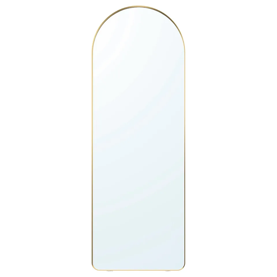 This image a LINDBYN mirror with a gold frame, round top, sleek design, and reflective glass surface. It can be hung on a wall or set on the floor.