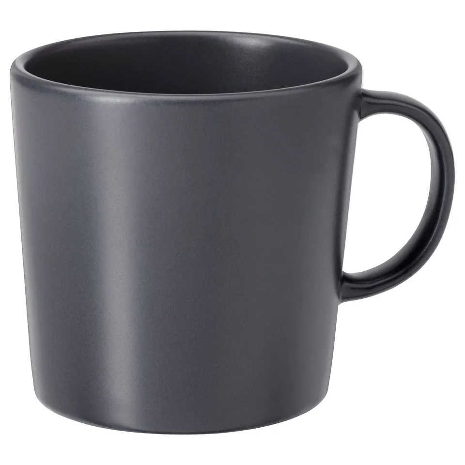 A DINERA ceramic mug in sleek black, crafted from stoneware with a matt finish, displaying a simple and rustic design.