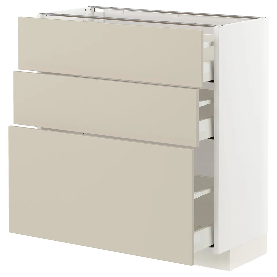 Beige METOD kitchen cabinet with three drawers, sleek design, white finish.