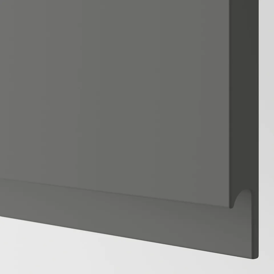 Modern kitchen cabinet in dark grey with sleek, integrated handle showing quality design.