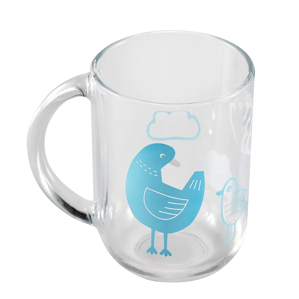 Clear glass mug with a blue bird and cloud design, featuring a sturdy handle. Ideal for any beverage.