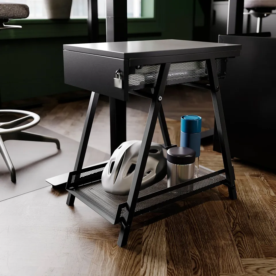 Black trottan storage unit with lockable drawer and mesh shelf for workspace.