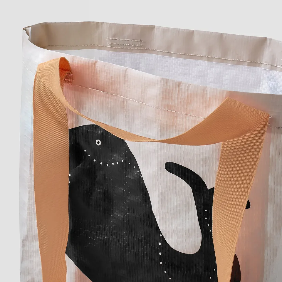 Durable, woven tote with stylish, geometric design; made from recycled materials.