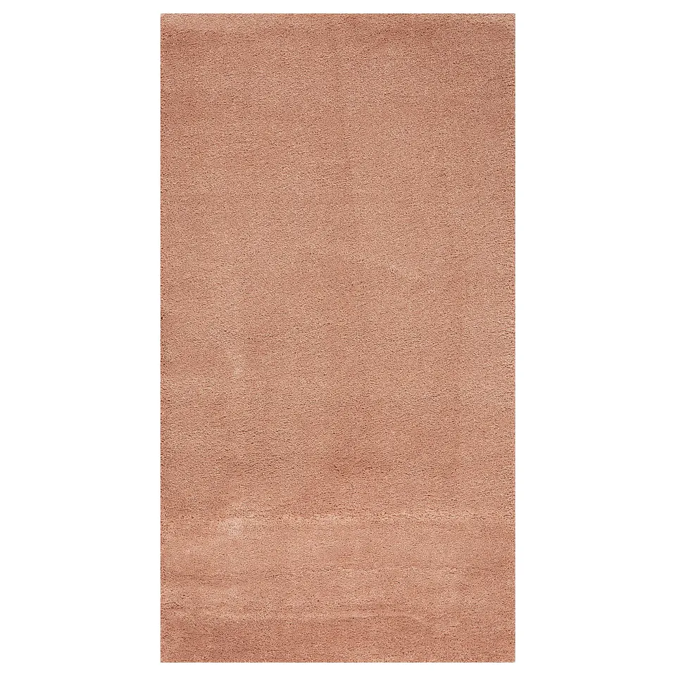 A STOENSE rug in pink. Made of polypropylene and synthetic rubber, its rectangular with a soft, plush texture and a slight sheen.