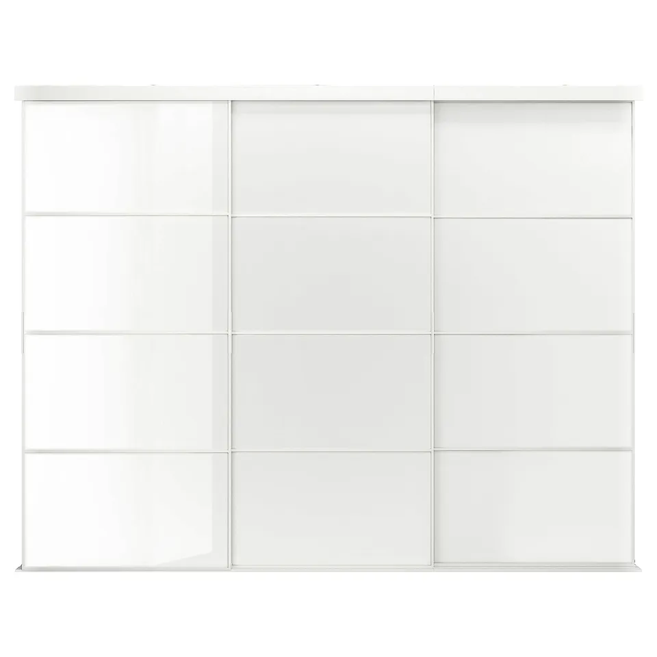 A white SKYTTA sliding door system with glass panels. It an aluminium frame and minimalist design.
