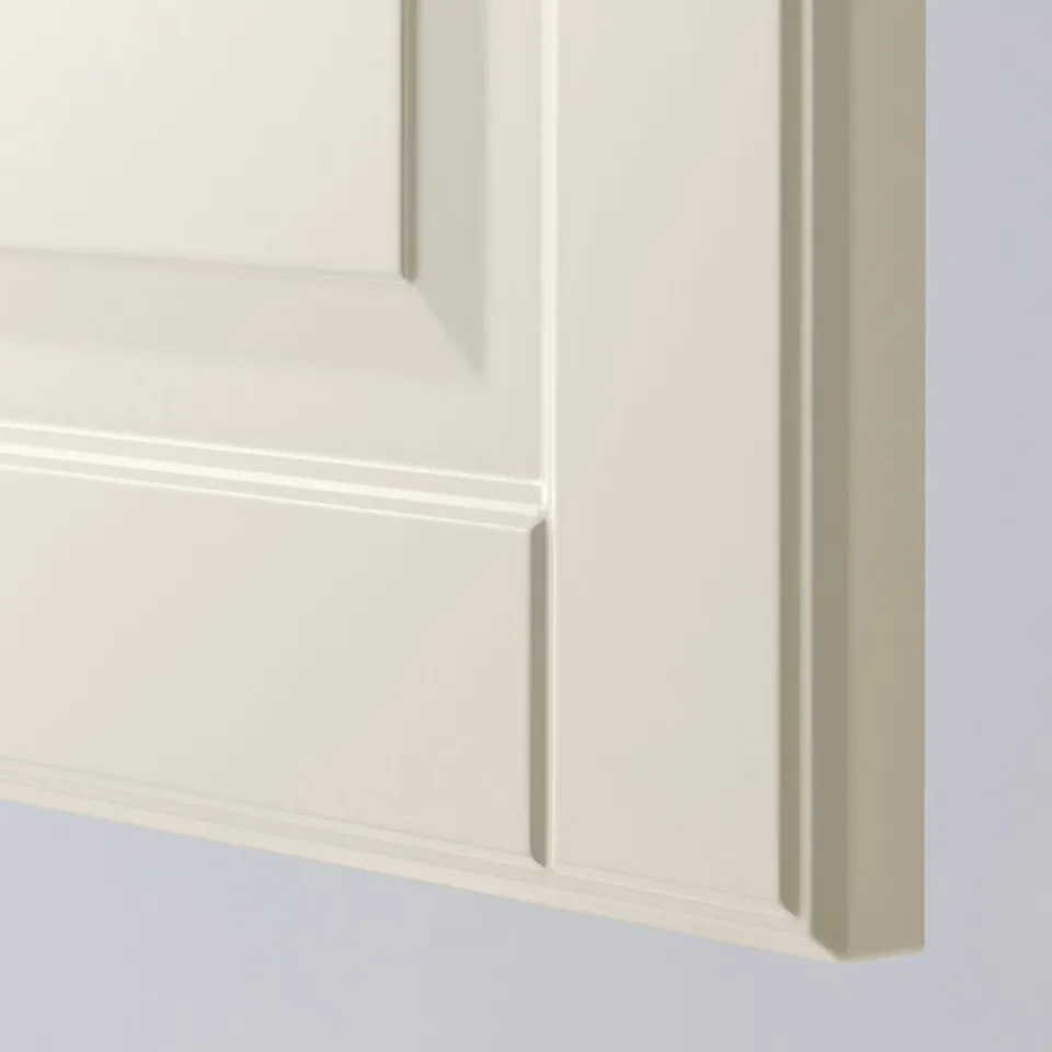 Close-up of crisp, off-white cabinet door with bevelled edges. Clean, smooth finish highlights quality craftsmanship.