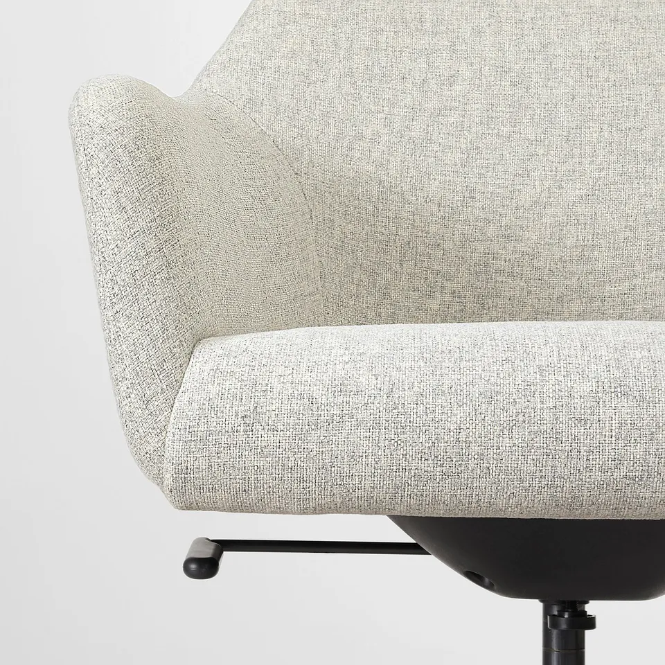 Close-up of a modern office chair with soft padding and durable fabric.