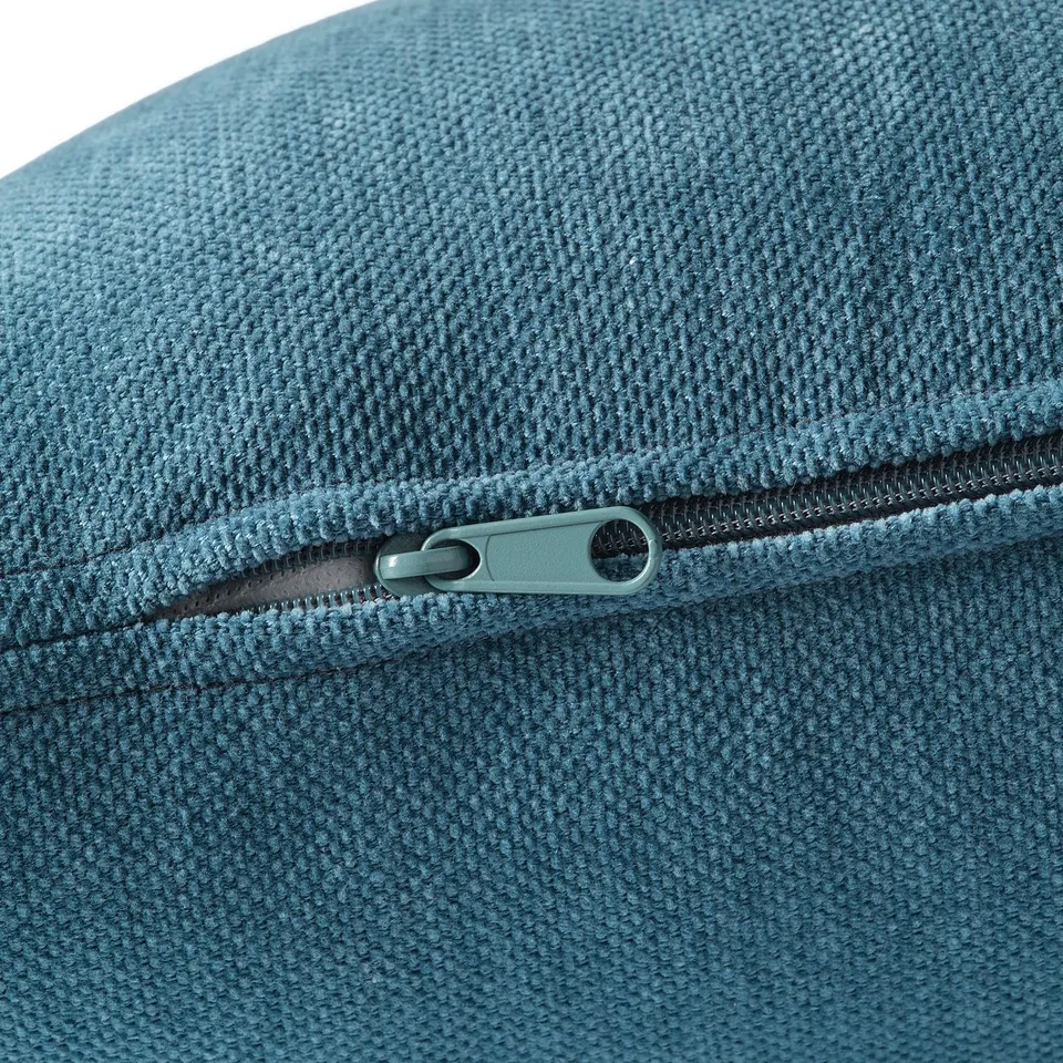 Close-up of SÖDERHAMN fabric, showing durable, soft chenille texture and smooth, sturdy zip.