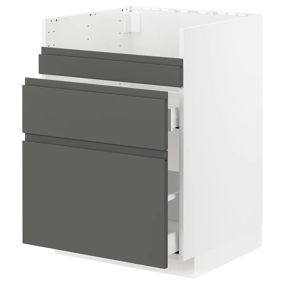 A modern kitchen cabinet from IKEAs METOD system, featuring three dark grey voxtorp drawers with integrated handles, set against a white background.
