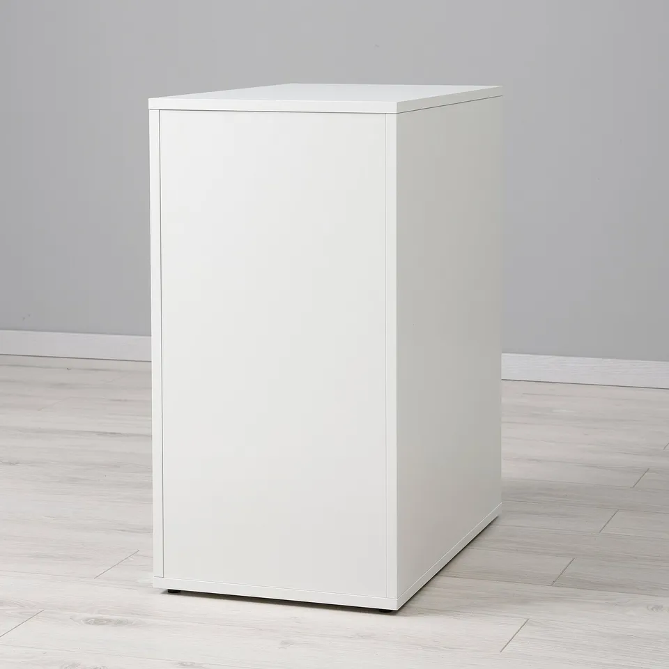 Modern, white, standalone cabinet with sleek design and finished back.