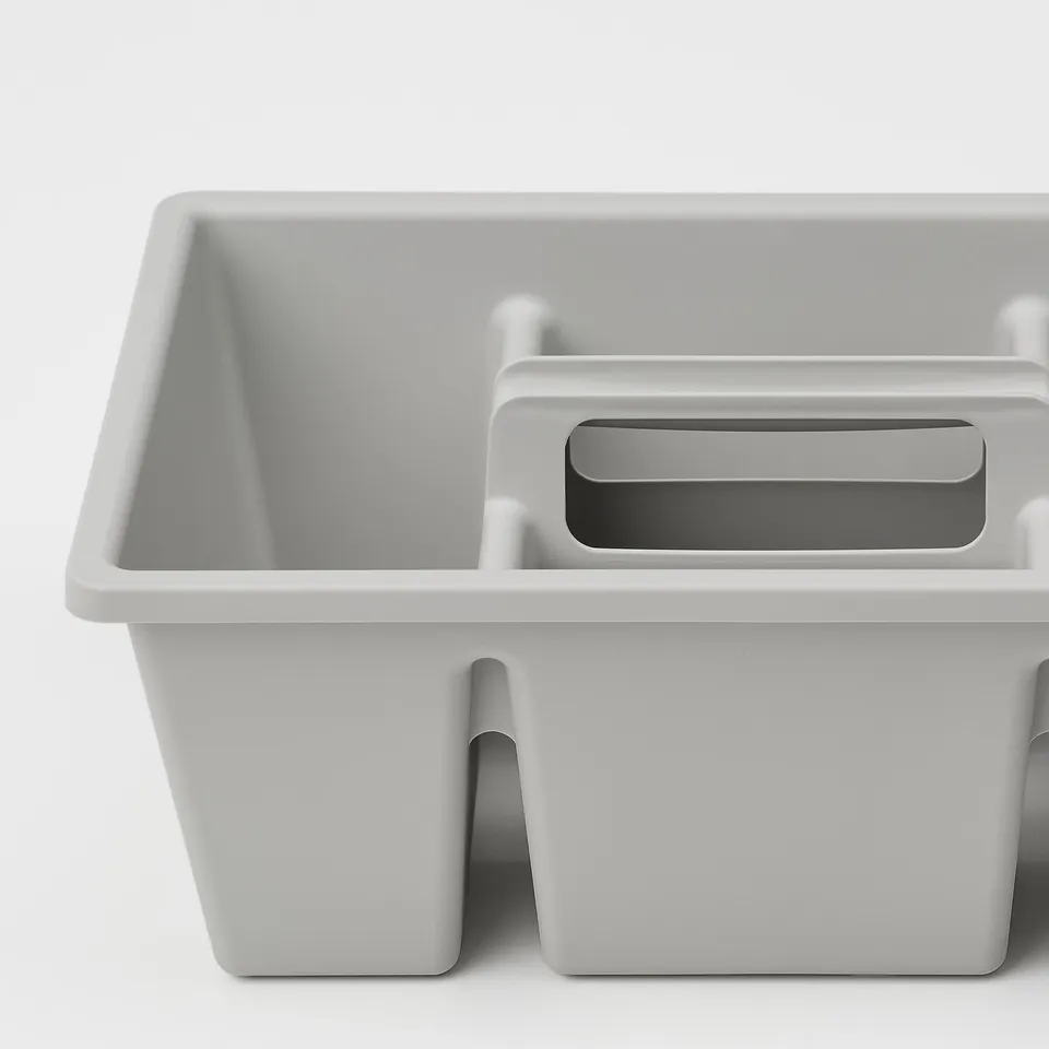 Grey plastic organiser tray with four compartments. Designed for drawer use, durable and efficient.