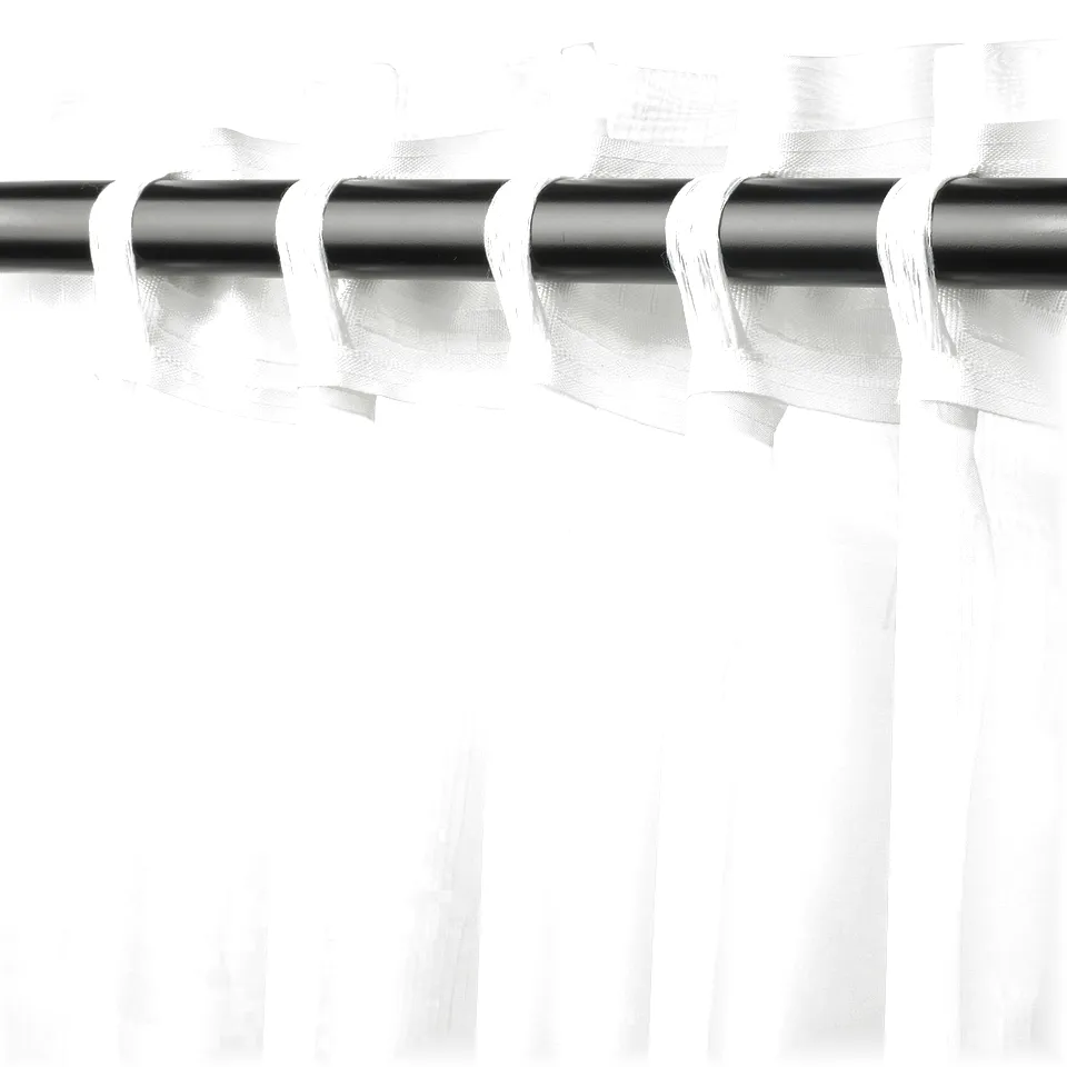 Curtains with subtle patterns, sheer, filtering light for privacy.