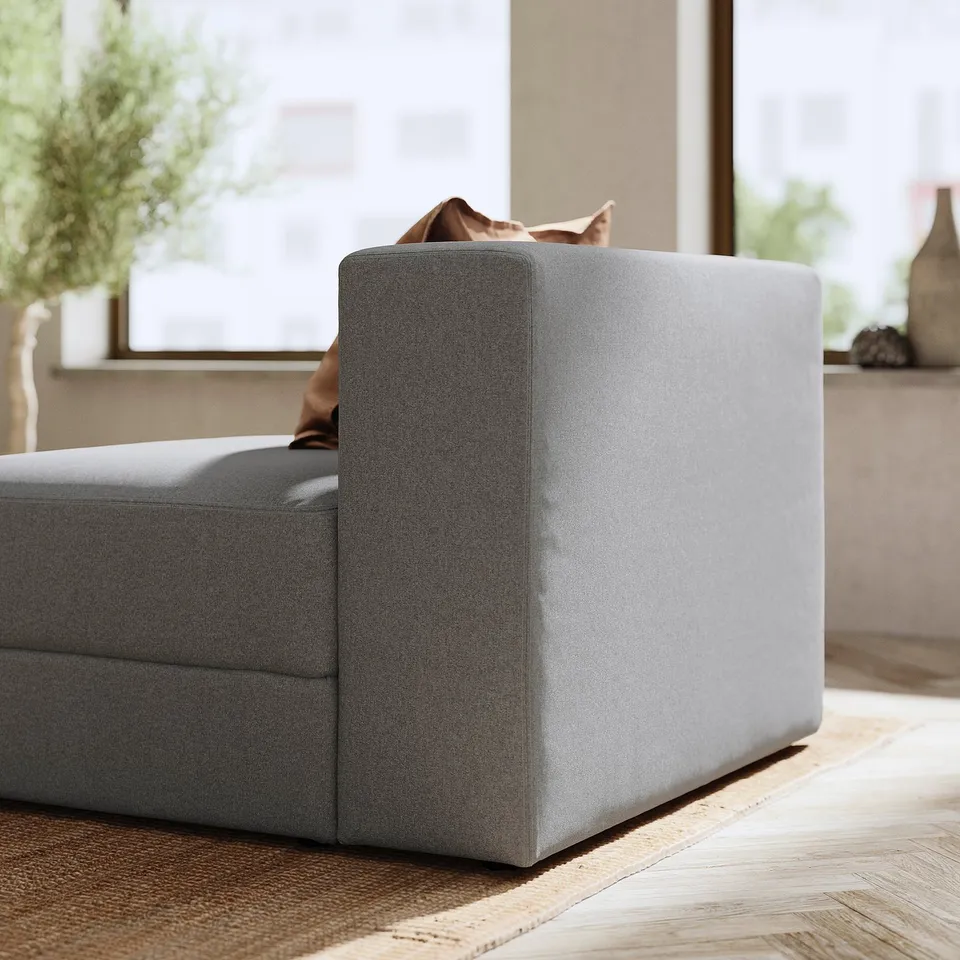 Modern grey JÄTTEBO sofa, sleek design, soft fabric, clean lines, perfect for relaxation.