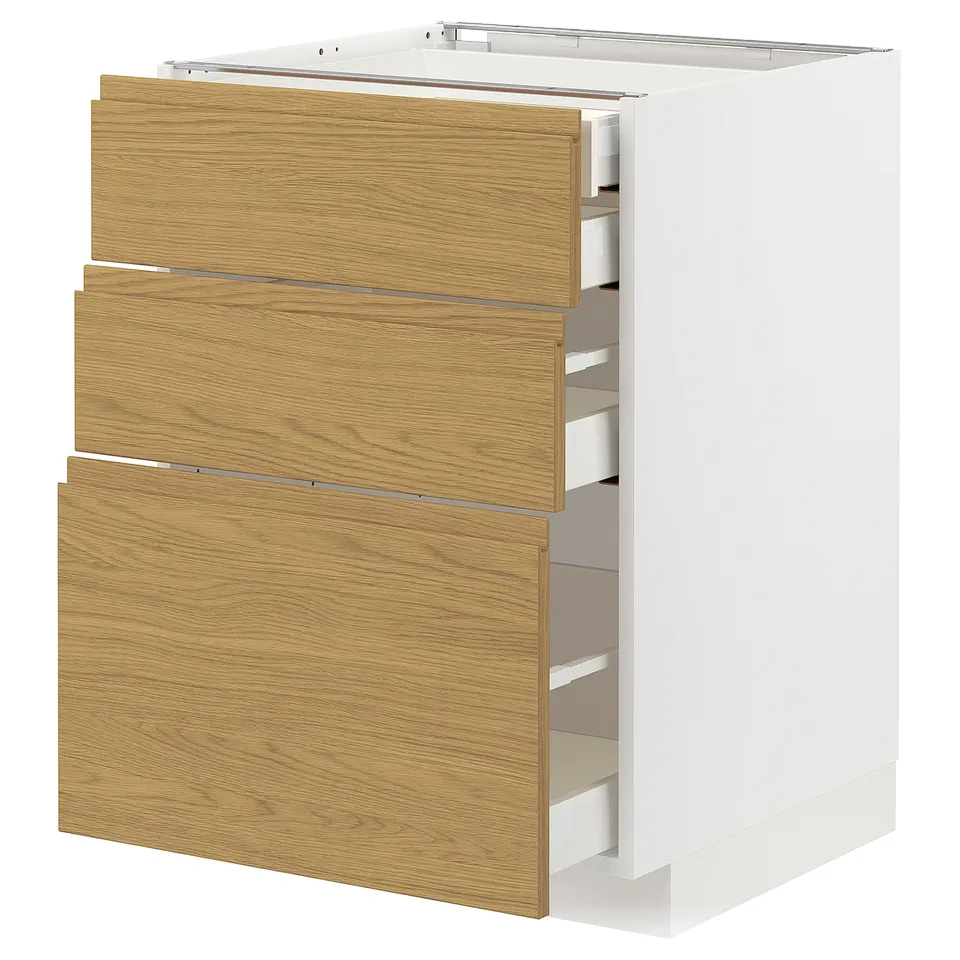 A METOD kitchen unit with three oak effect drawers, white base, and sleek, integrated handles.