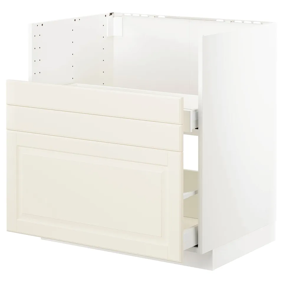 A white METOD kitchen cabinet set with off-white, bevelled edges. It includes an oven/sink base and multiple drawers for storage.