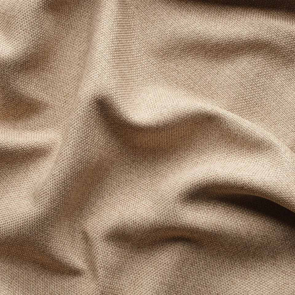 Close-up of beige fabric curtains, showcasing dense texture and quality material.