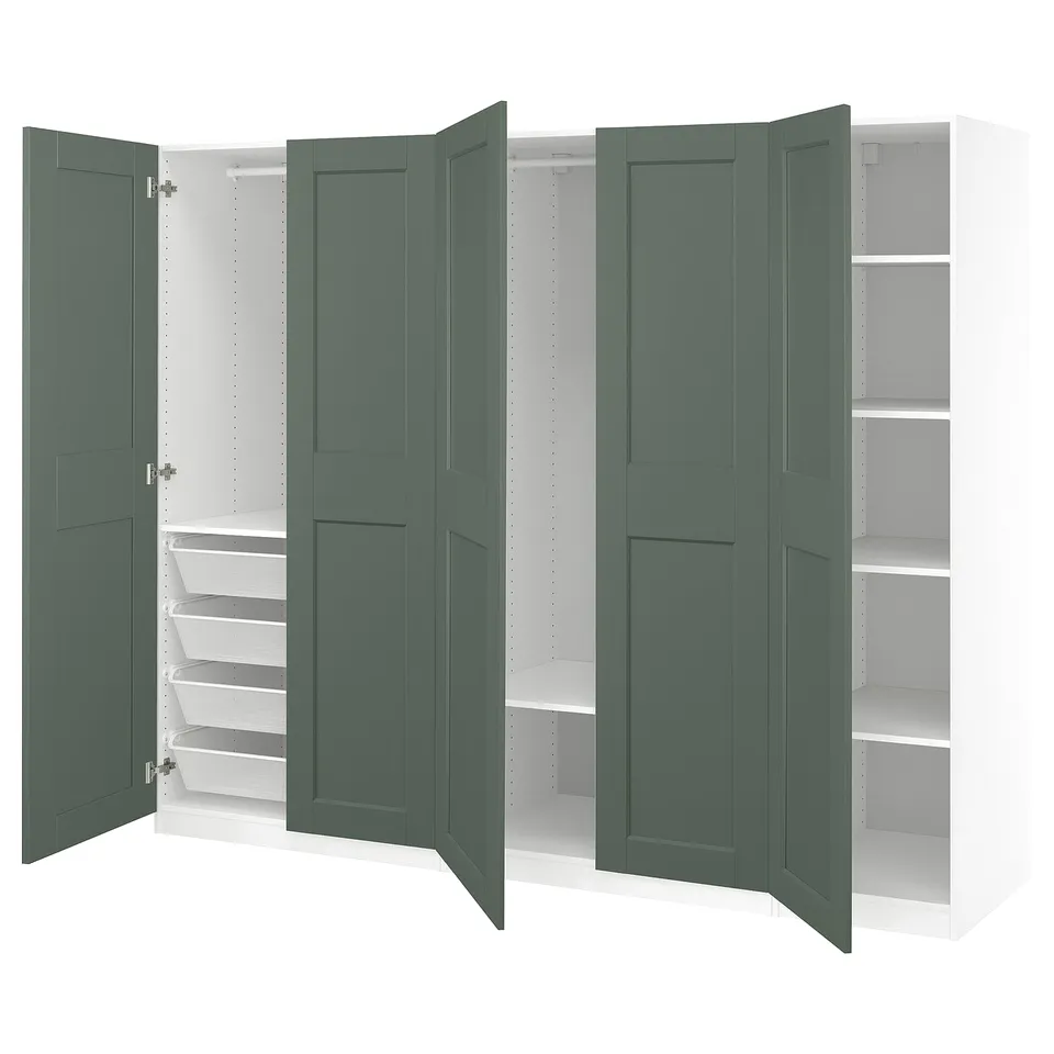 Open green PAX wardrobe with shelves, drawers, and hanging sections, modern design with soft-close hinges.
