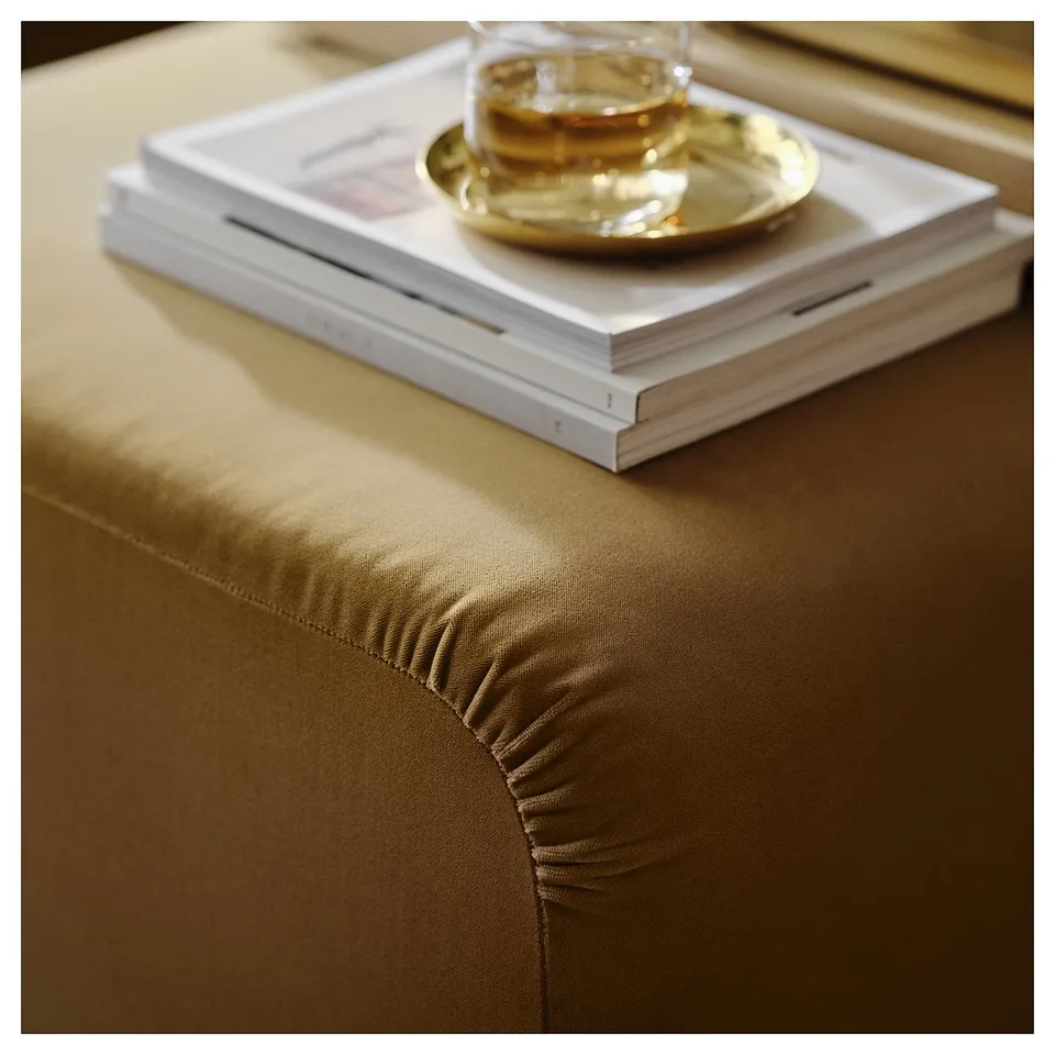 Well-crafted bed with smooth, durable fabric, featuring stylish decor on top.