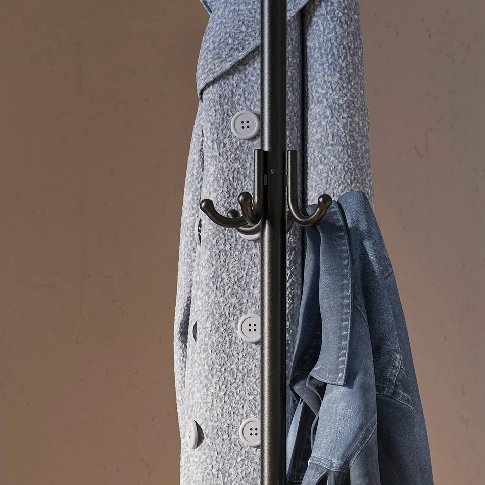 Coat stand with hooks holding clothes, showcasing storage functionality.