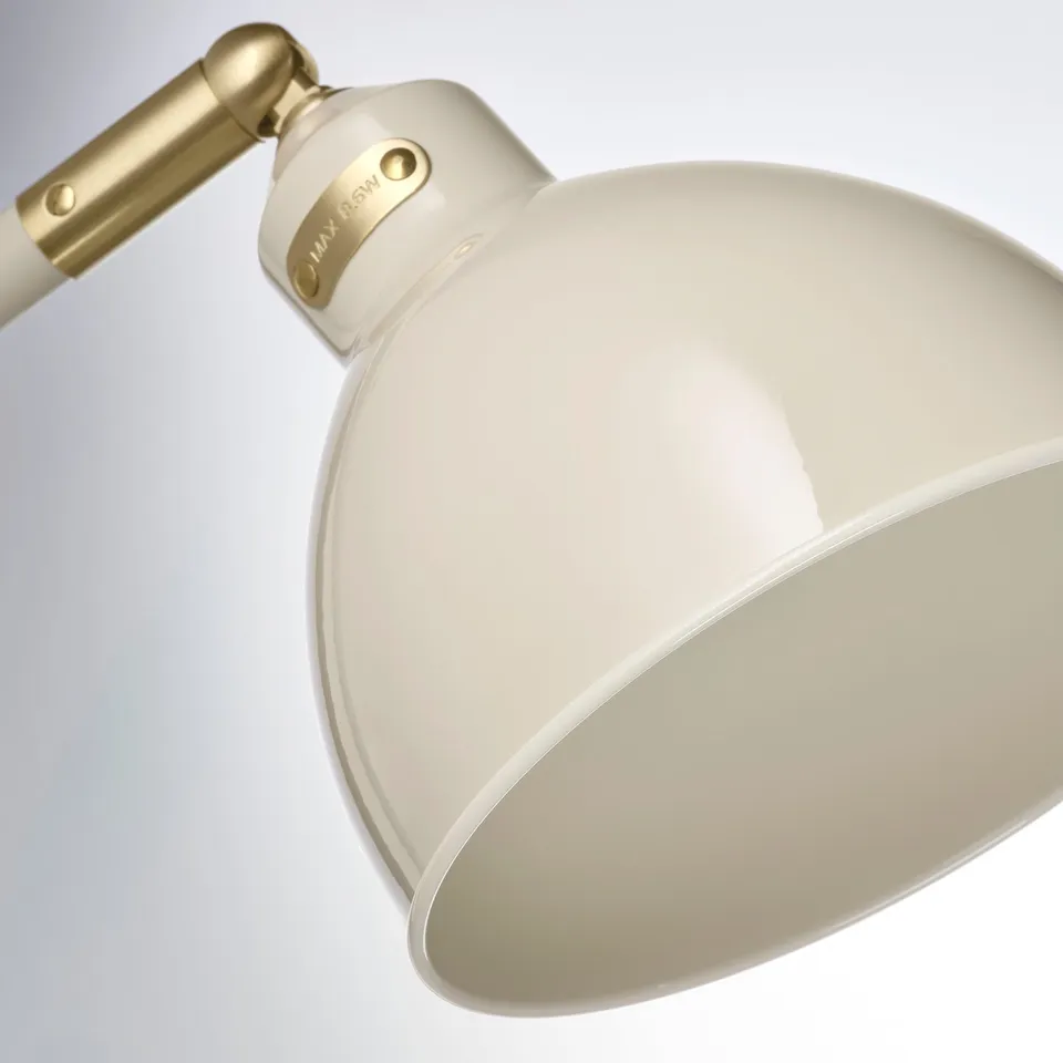 Desk lamp with glossy finish and adjustable shade