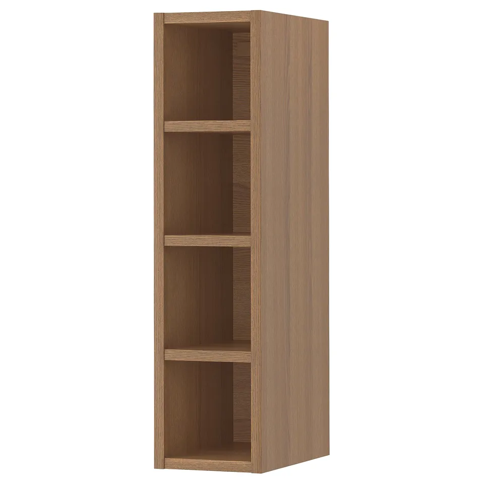A VADHOLMA wooden shelving unit in a natural oak finish. Its rectangular with three open shelves, ideal for storage and display.