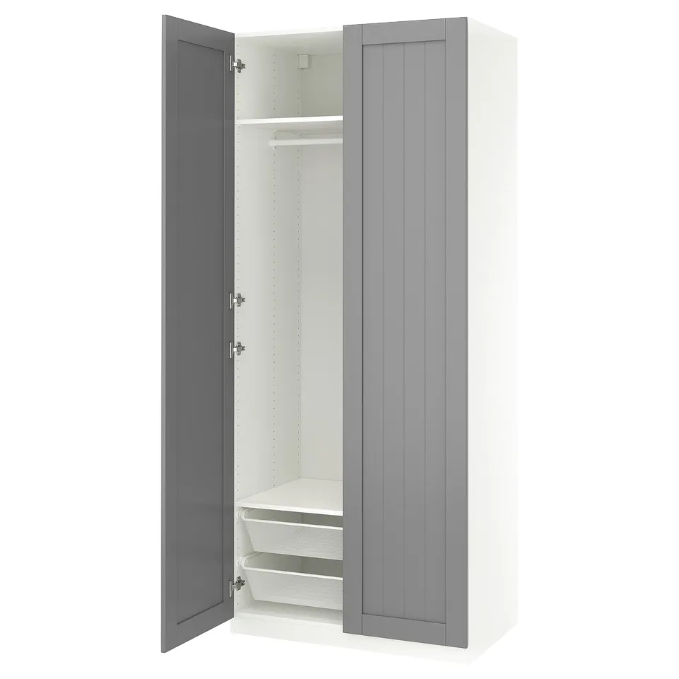 White and grey PAX wardrobe with open door, mesh baskets.