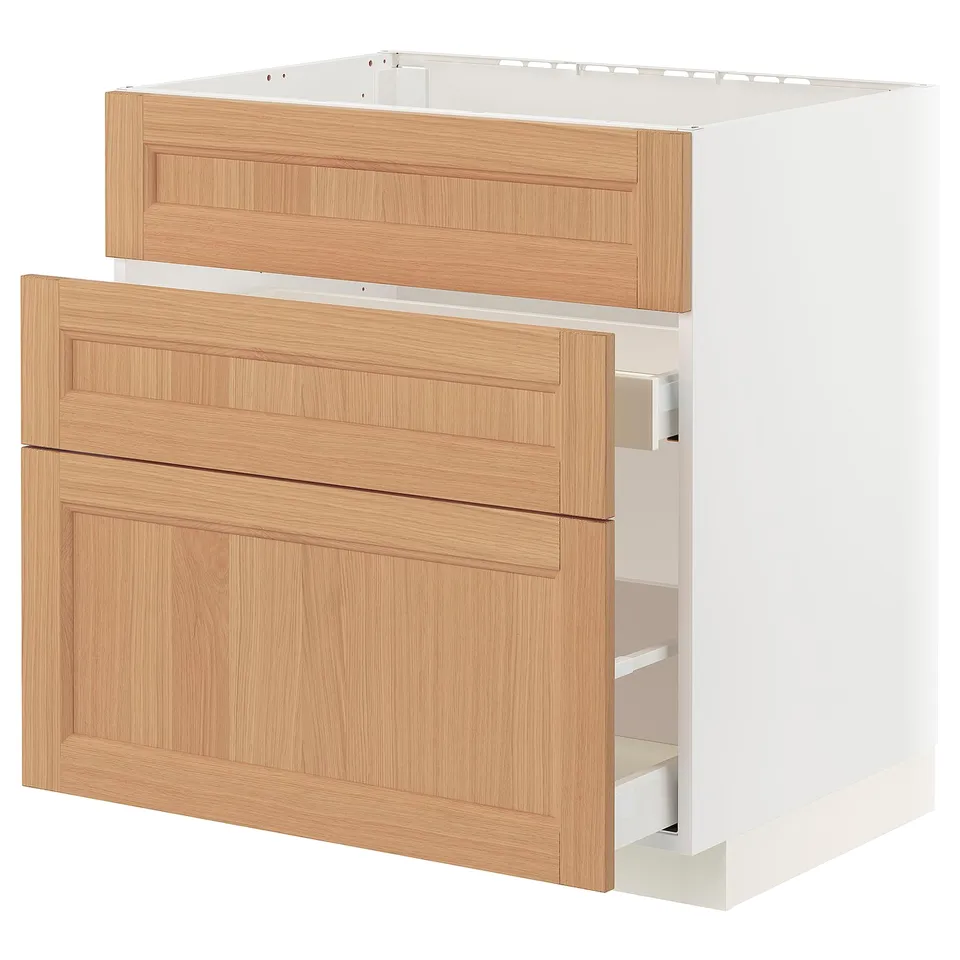 A METOD kitchen cabinet with two wooden drawers, oak colour, and a white base. It smooth-running drawers with a natural, warm look.