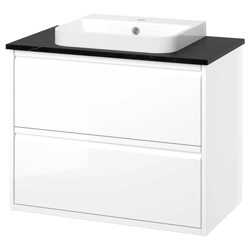ÄNGSJÖN white bathroom vanity with black countertop and sink.