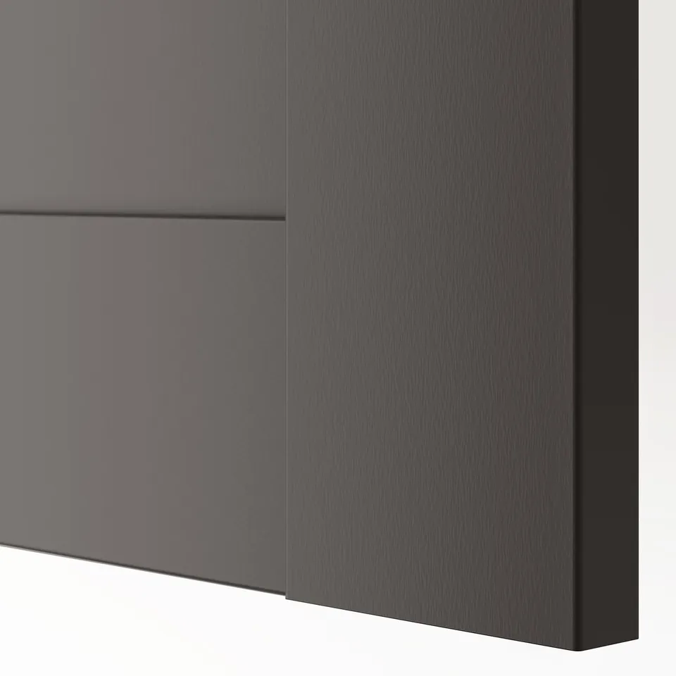 Close-up of a modern, dark grey cabinet door with a sleek, semi-matte finish. Shows detailed texture and craftsmanship.