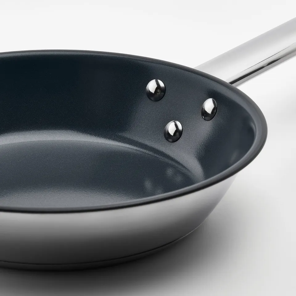 Image shows a high-quality stainless steel pan with a sleek handle and durable non-stick interior, designed for easy cooking and cleaning.