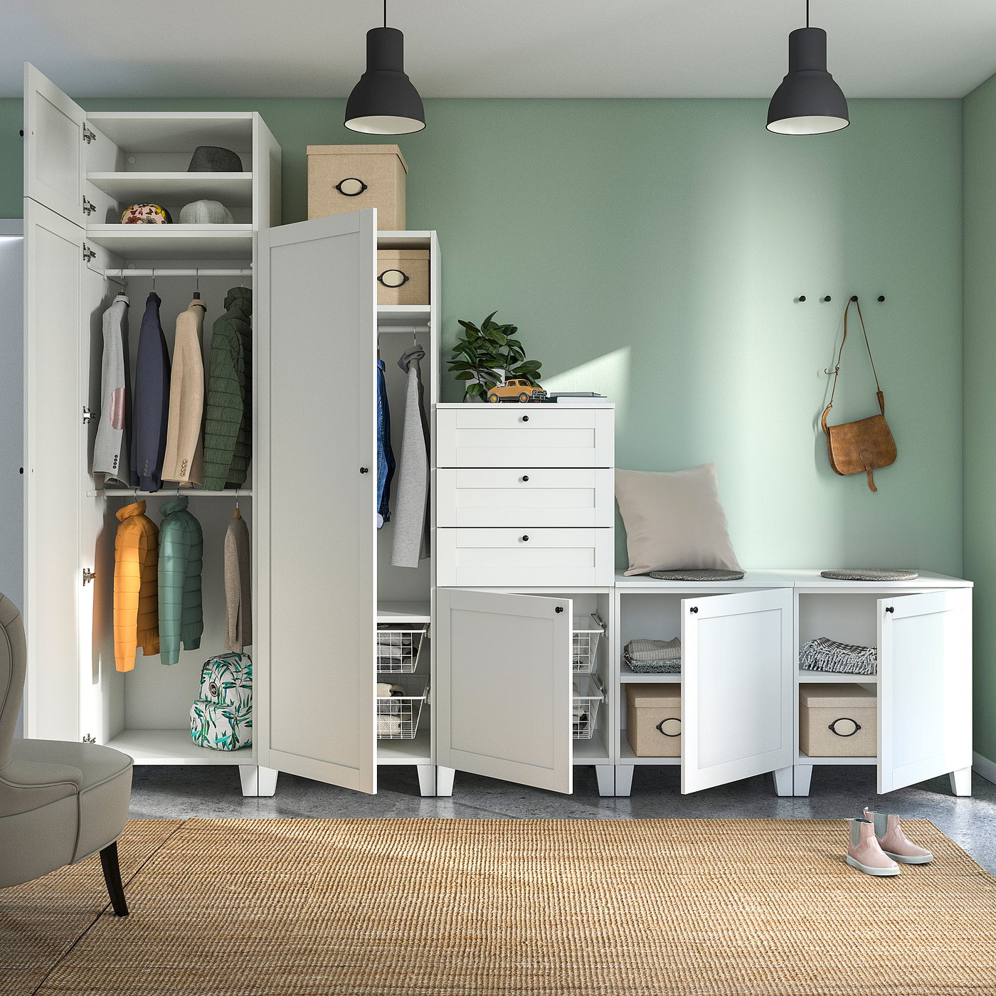 Open wardrobe with clothes, white drawers, plant, pillow, bag, chair, rug.