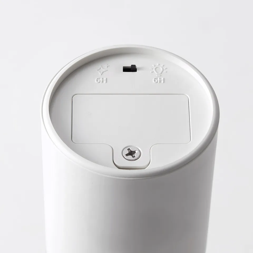 White modern lamp with smooth finish, built-in timer, and sleek design.