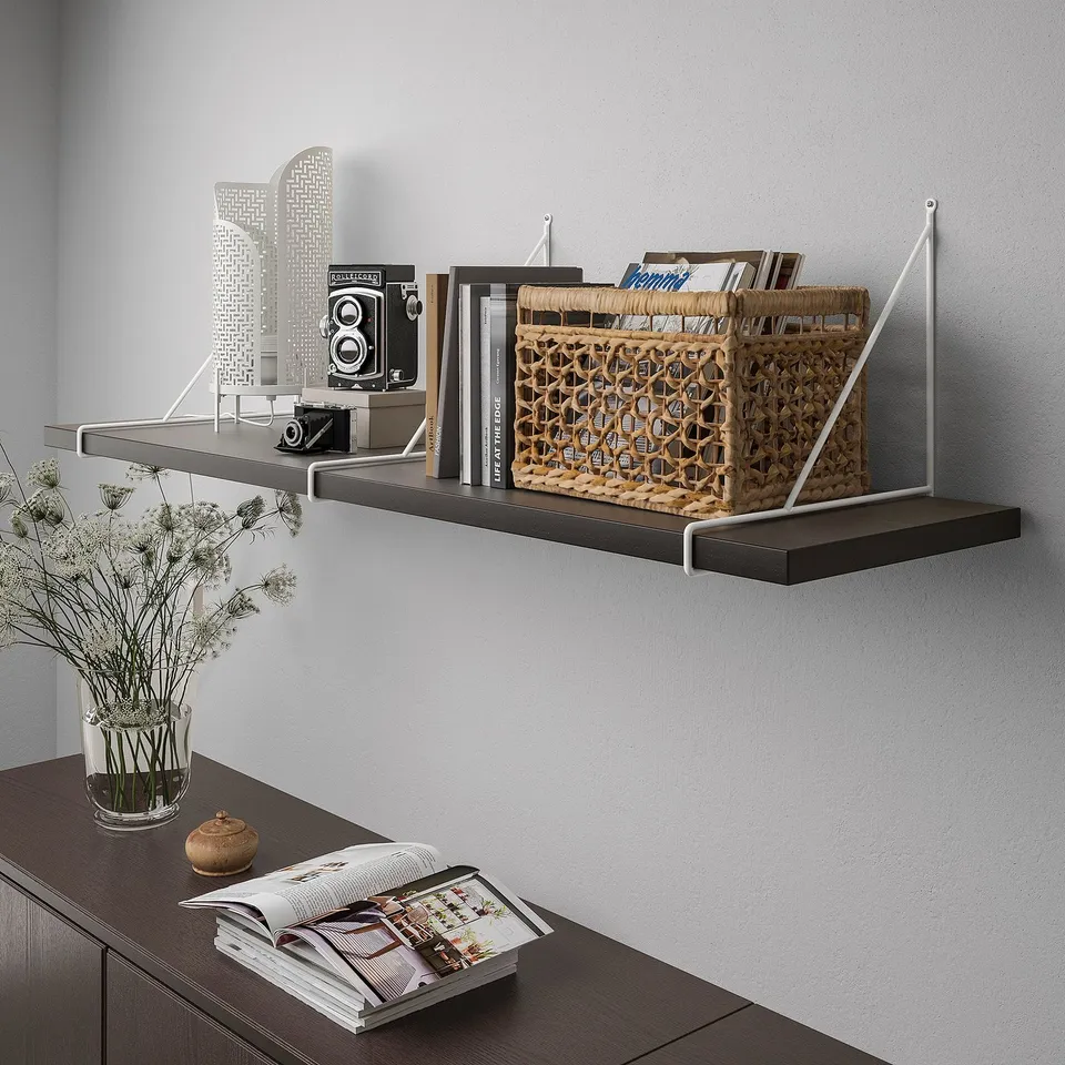 Wall-mounted shelf unit with decorative items, including books and a basket, displaying organisational use.