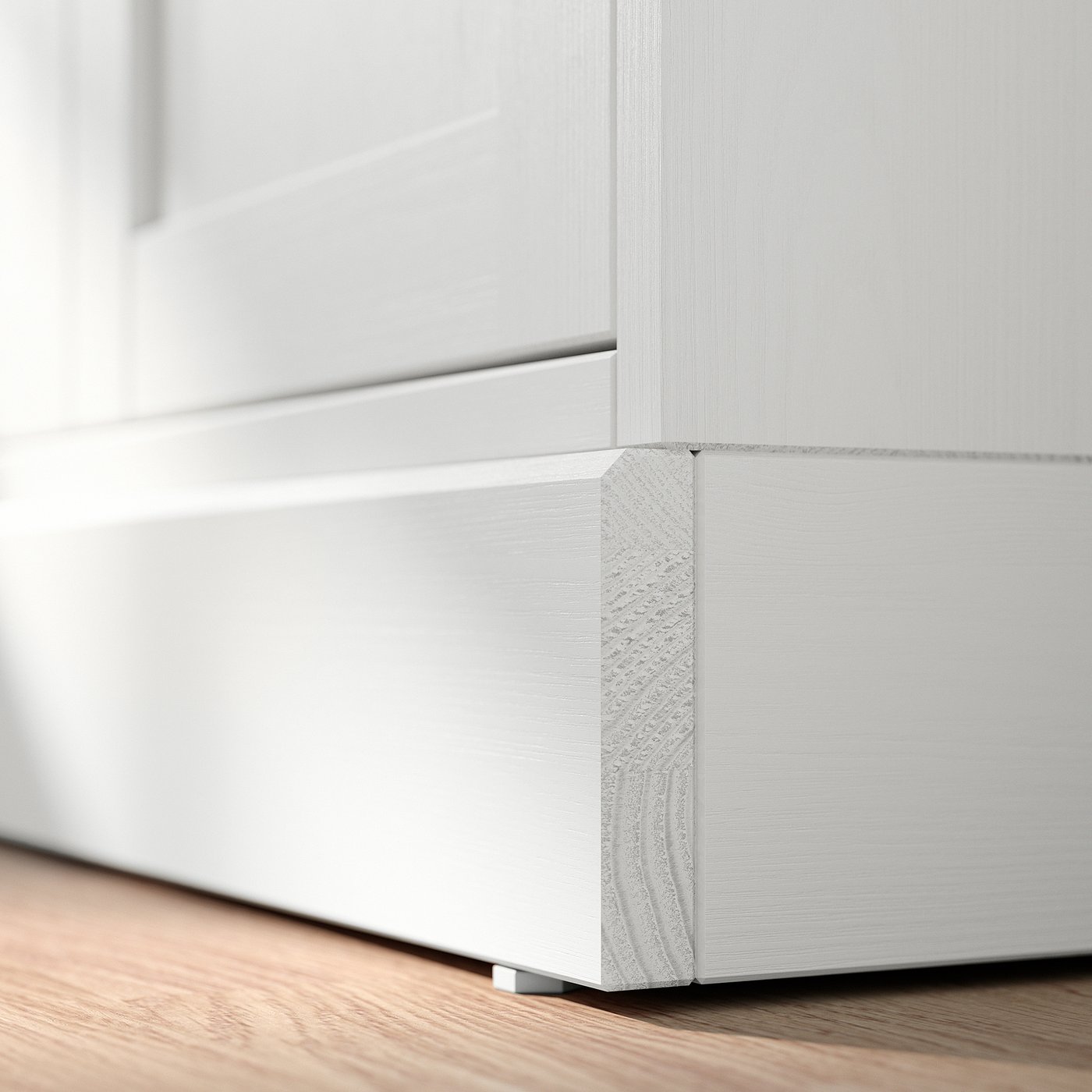 A white HAVSTA cabinet with a brushed pine finish, featuring clean lines and adjustable shelves.