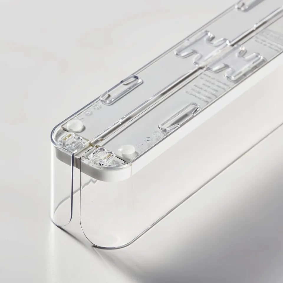 Clear, sturdy plastic drink holder for fridge, adjustable and connected, ensuring organised and easy access to beverages.