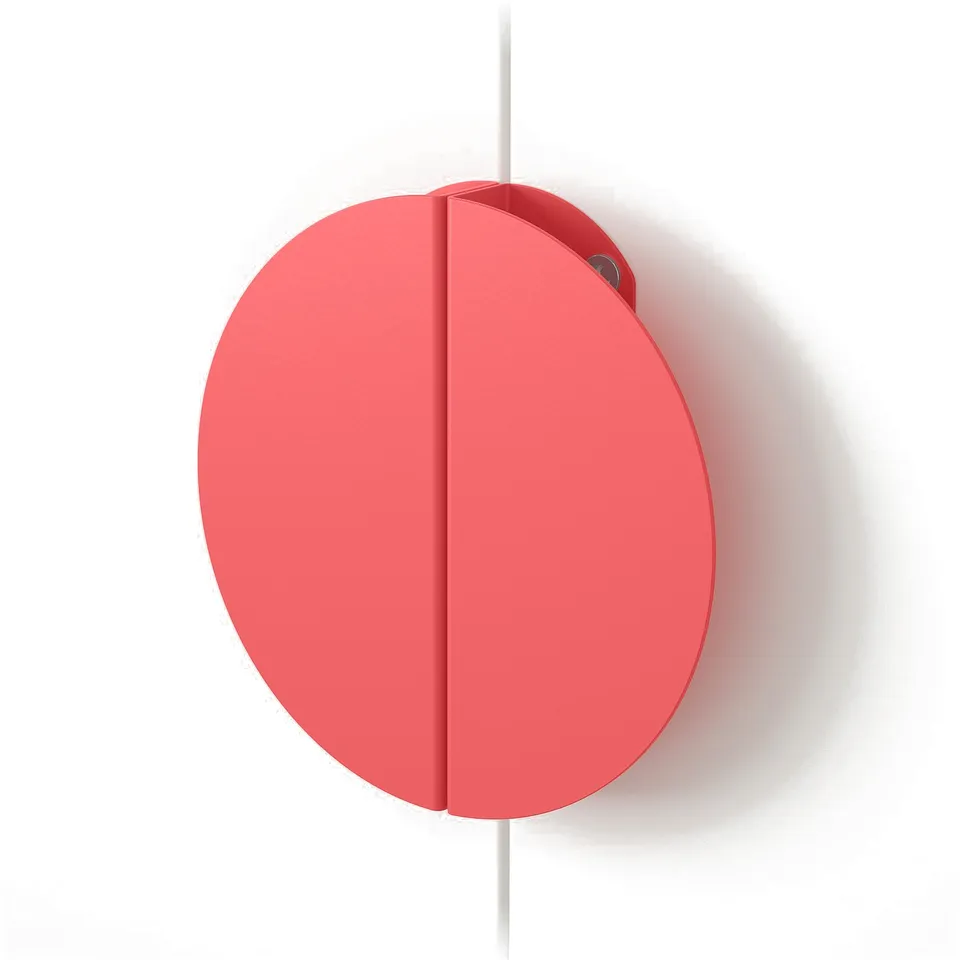 Red circular handle, smooth finish, mounted on a wall, high quality design.