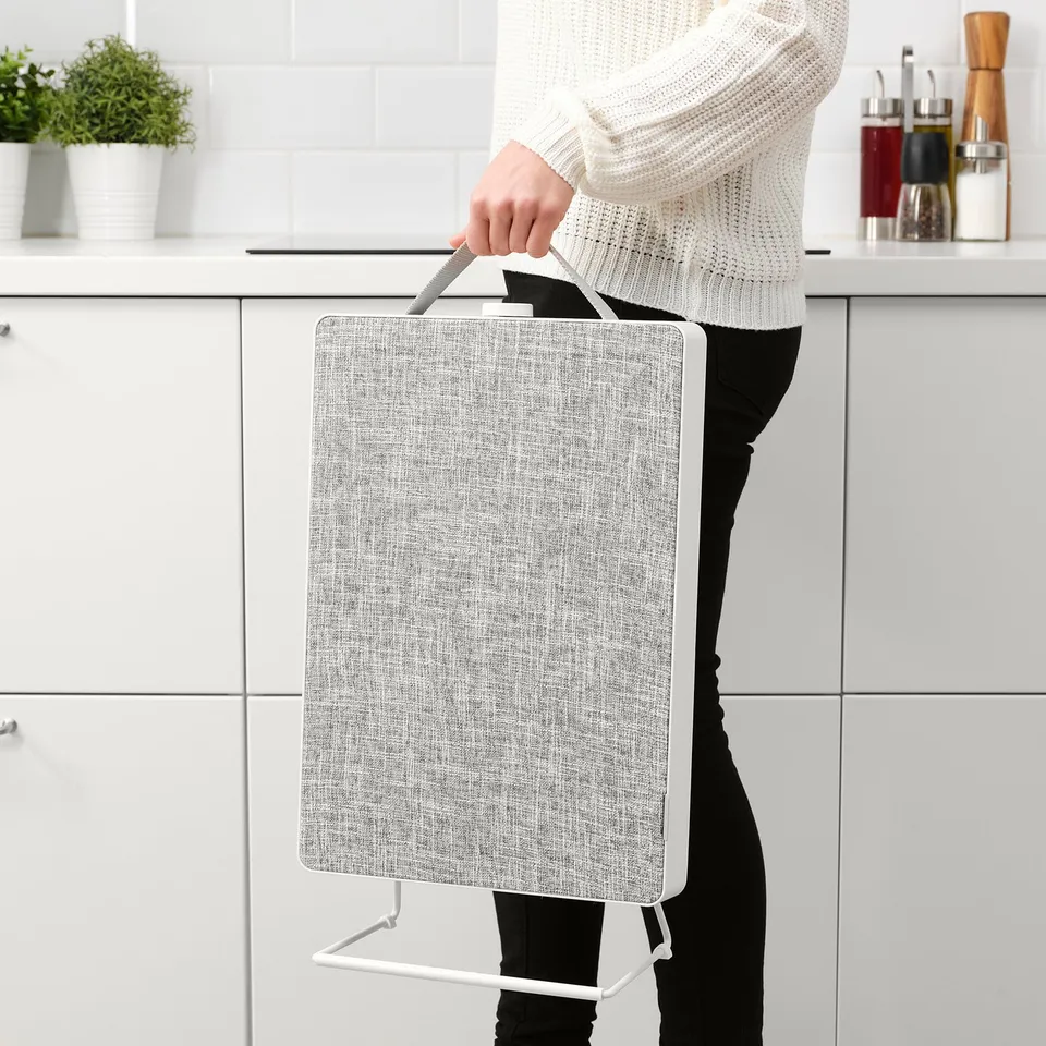 Person with portable air purifier.