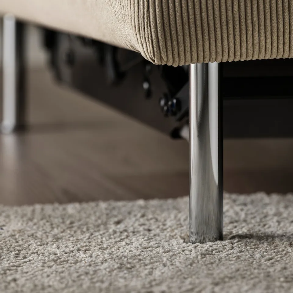 Close-up of a modern sofas sleek metal legs and plush cushions. A stylish blend of comfort and minimalist design.