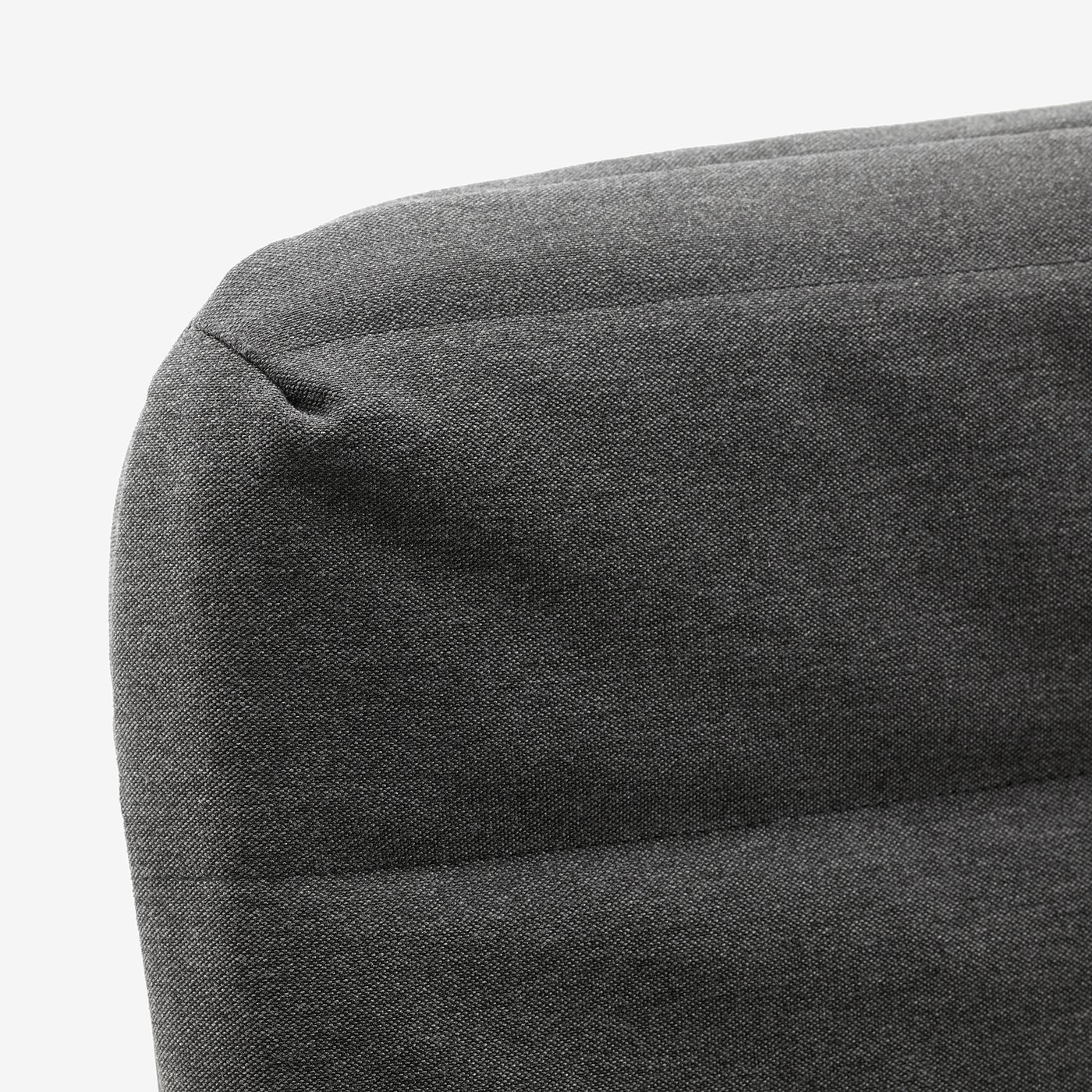 Close-up of grey fabric sofa, smooth texture, clean lines, modern design.