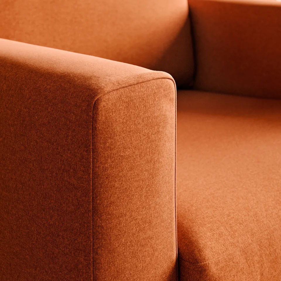 Close-up of quality upholstered furniture, showcasing soft, durable fabric and neat seam detailing.
