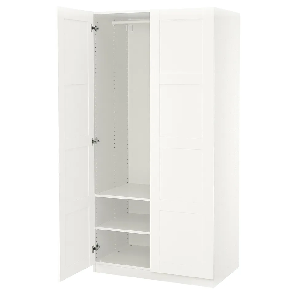 White PAX wardrobe, open, featuring adjustable feet and interior shelves for organisation.